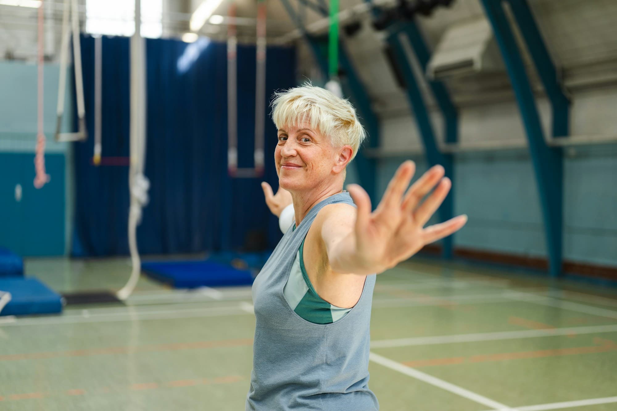 Older adult exercising in fitness centre